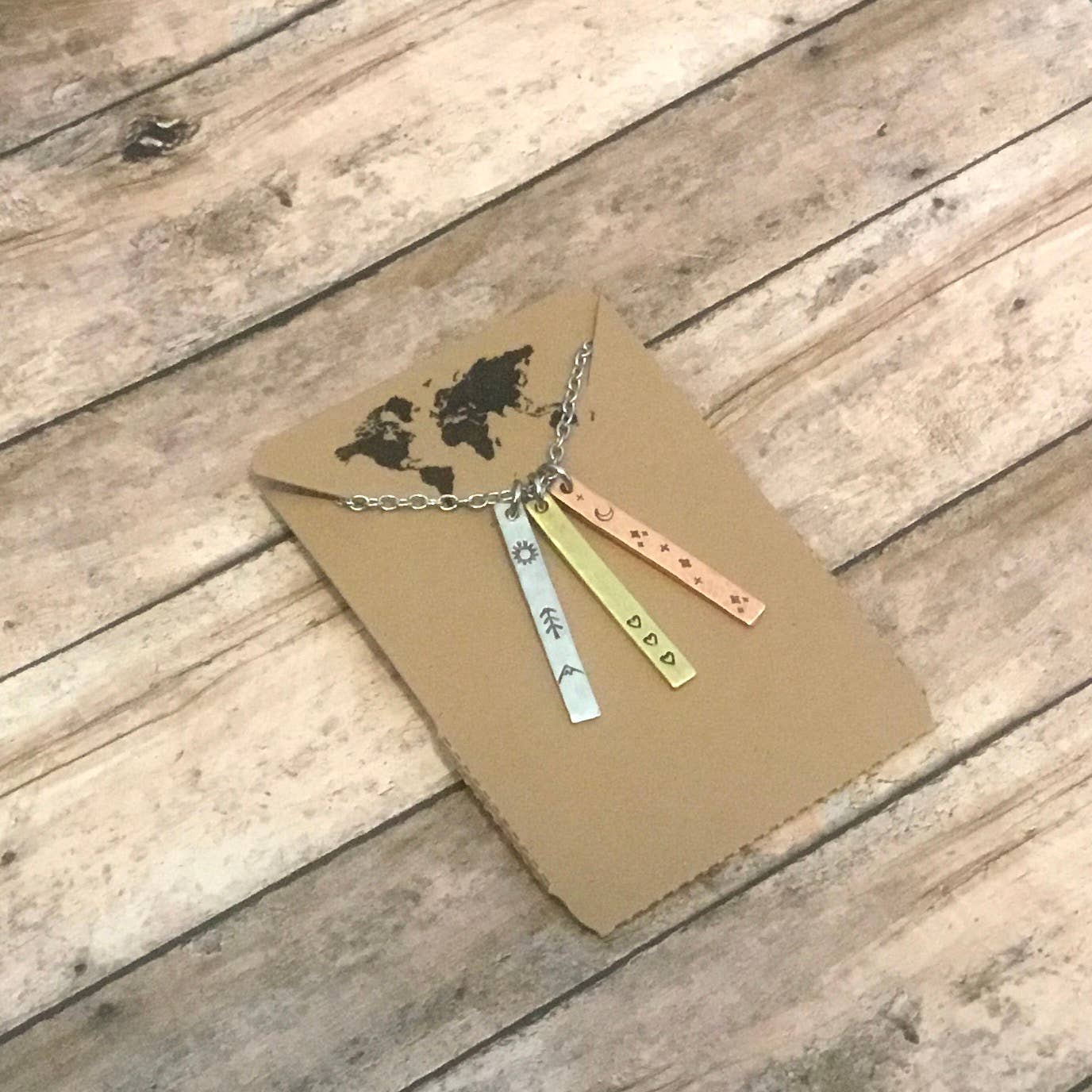 Sun, moon, and hearts trio, mixed metal charm necklace